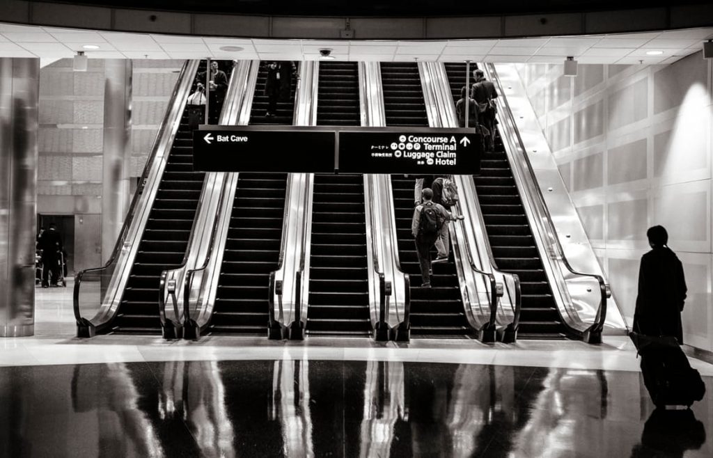 stairs-people-airport-escalators