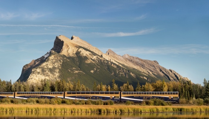 Train riding along a mountain